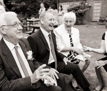 The Professional Icebreaker performs close up magic to older wedding guests.